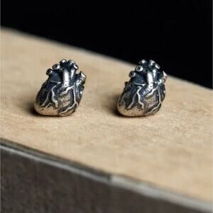Anatomical heart shaped silver tone earrings